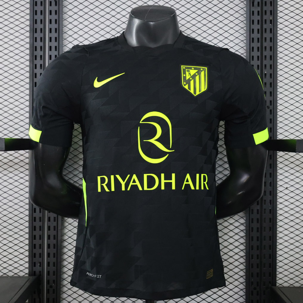 maglia atletico madrid giocatore away 2026/27 vista frontale nera e giallo fluo