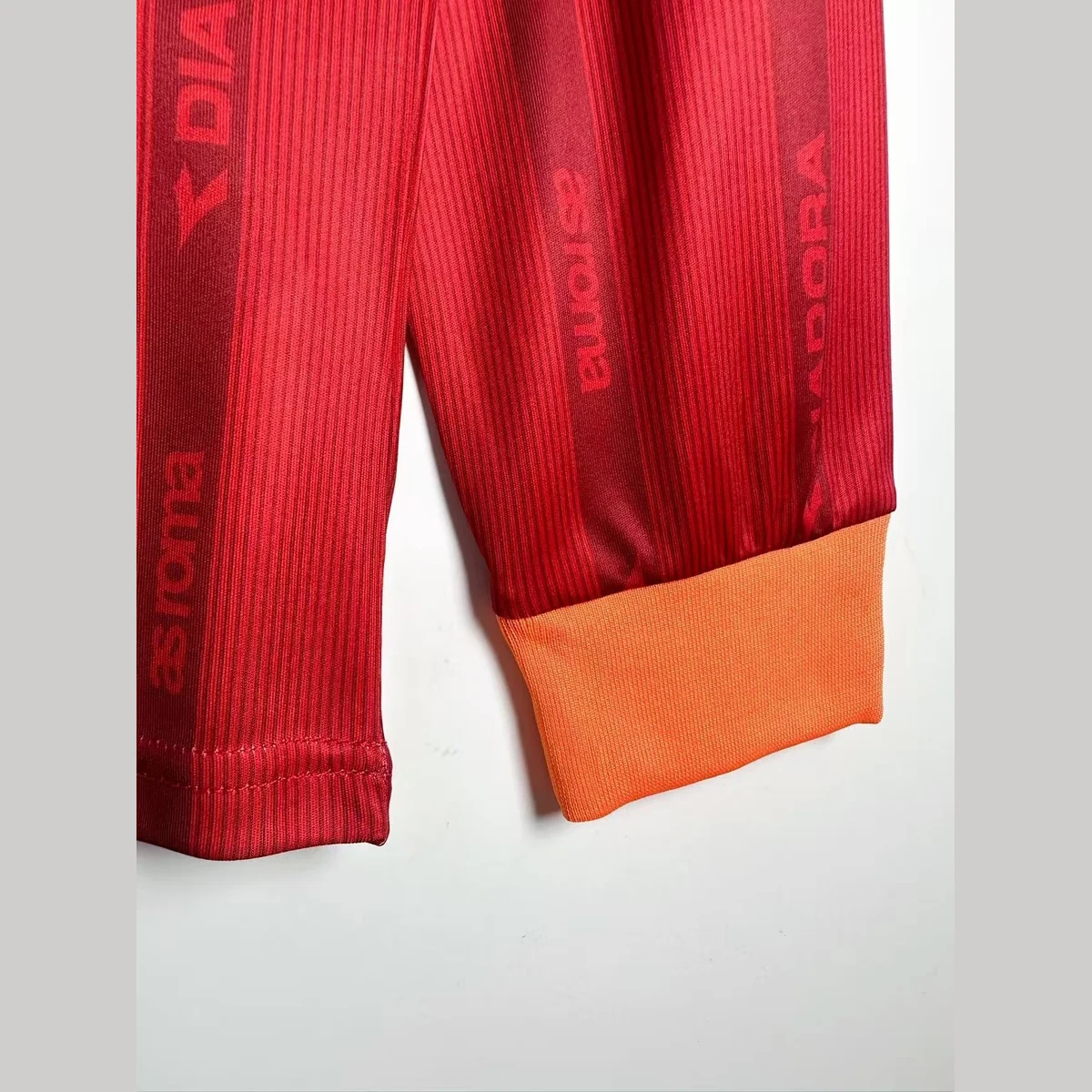 Polsino arancione della maglia Roma 1999/00 manica lunga