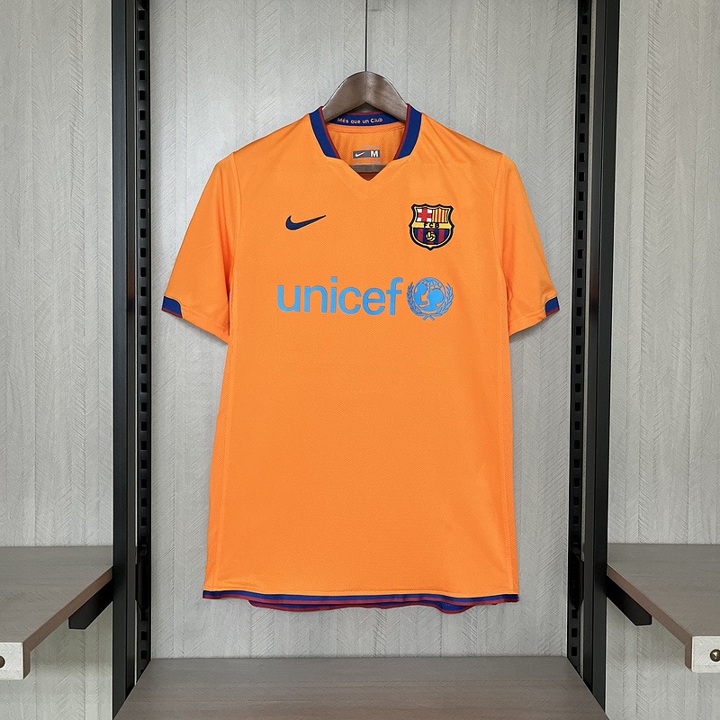 maglia barcellona away 2007 fronte arancione con dettagli blu
