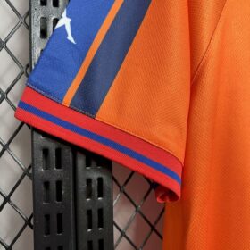 camiseta barcellona arancione polsino a righe blaugrana