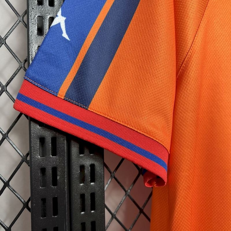 maglia barcellona arancione polsino a righe blaugrana