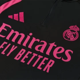 Chándal Real Madrid Niño Negro y Rosa 2026/27 — Detalle de materiales y logo
