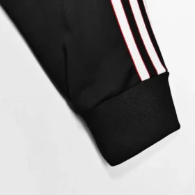 Chaqueta Manchester United Stone Roses Negra y Azul – foto real del tejido y los acabados