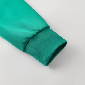 Tuta Algeria Verde Zip Completa con Collo Alto 2026 – foto reale del tessuto e delle finiture