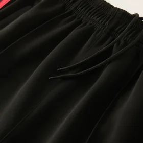 Tuta Giamaica Nera Full Zip con Strisce Tricolori 2026/27 – vita e tessuto reali dei pantaloni